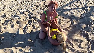 Two Lesbian Hotties Wrestling on the Beach and After That Start Kissing