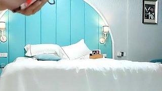 Cute amateur asian web cam girl playing with her toy