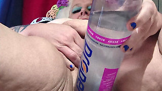 Big Bottle Plugged Clit Cunt