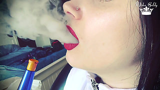 Smoke from dark red big lips