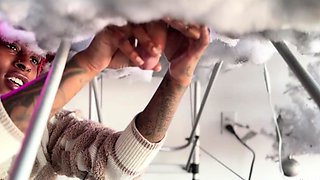 Pierced and tattooed boy sucking black cock from glory hole