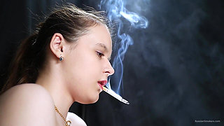 Topless Brunette Smoking in Dramatic Smoke