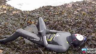Rubbery Beach Encounter: Lucy's Neoprene Pussy Play with Stranger