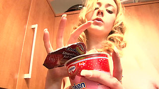 Blonde babe with big tits gets naked in the kitchen