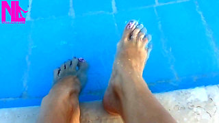 Barefoot Dangling in Swimming Pool Water