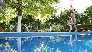 Sweet Lila poses by the pool