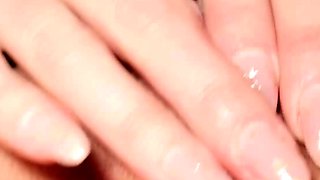 Blonde mature with big boobs masturbates in bed