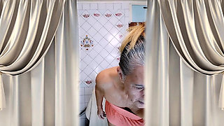 Elderly Housewife Lukerya in the Kitchen. Cheerful Flirtation