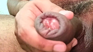 Latino Man Masturbating His Large, Dark, Curvy, Uncut Cock with Both Hands