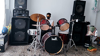 Best female friend performs a sexy dance for her male friend while he plays the drums.