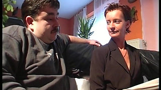 Sexy German slut in stockings takes care of two cocks