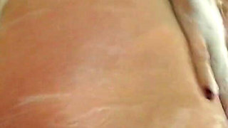 Camilla scrubs up in the shower