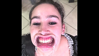 French Maid Tries to Swallow Her Own Piss Through Lip Retractor