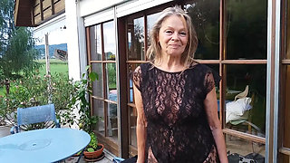 A Mature Woman Shows off Her Figure Outside in a Lace Bodysuit!