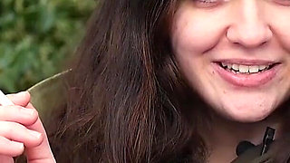 Young Brunette Is Taking an Unhurried Stroll with Allwhite 120mm Cigarette