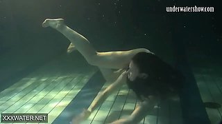 Shaved brunette sissy Irina Polcharova naked in the pool