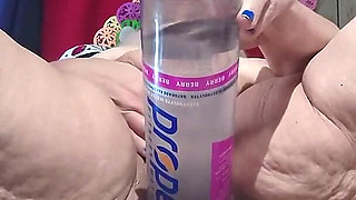 Big Bottle Plugged Clit Cunt