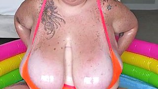 Daytona Oil Pool (4K) - Brunette mature with oiled up monster tits