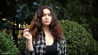 Sweet and Busty Russian Babe Smoking Cigarette in Nature
