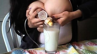 Hot babe with big boobs playing with her lactating boobs