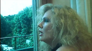 Marina Lotar in 2 Vintage Scenes: a Threesome and Doggy Style with Roberto Malone.