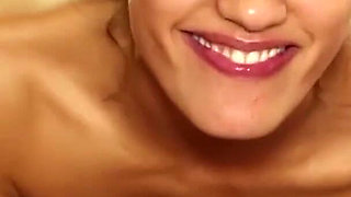 Alluring babe is blowing guy's cock in the bathroom