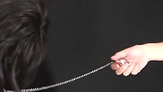 Mistress Teases Cross-dressing Masochist with Cane and Hot Wax and Uses Nipple Clips to Enlarge and Train His Nipples