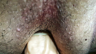Anal pegging of a slave in a chastity belt. Strap-on anal fucking, POV and close-up.