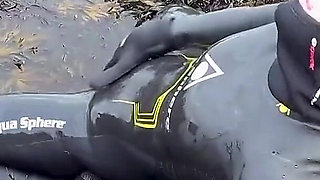 Rubbery Beach Encounter: Lucy's Neoprene Pussy Play with Stranger