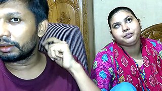 Newlywed couple and their friend getting cozy in an Indian village