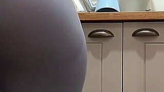 Sexy Brazilian Woman Tidying up the House with Leggings