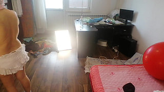 Amateur woman has fun trying on clothes and cutting them.
