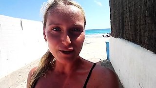 Outdoor solo masturbation scene with curly blonde